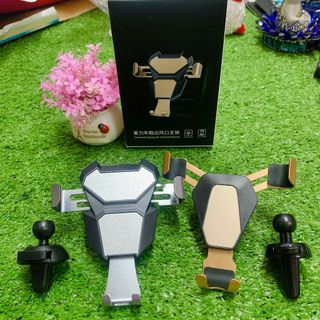 Giá đỡ điện thoại kẹp cửa điều hoà ô tô công cơ học cảm ứng trọng lực hợp kim