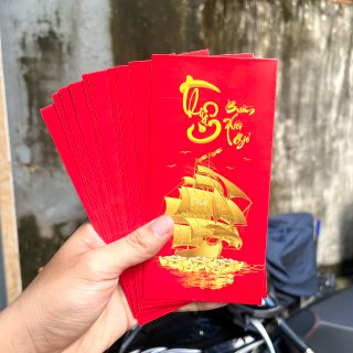 Bao lì xì tết 2024 2 mẫu:  hình rồng vàng và hình thuận buồm xuôi gió. Chuyên sỉ 1000 tấm siêu rẻ