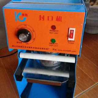 Máy ép miệng ly IC27