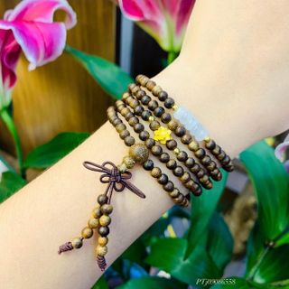 VÒNG TAY TRẦM HƯƠNG TỐC THIÊN NHIÊN PHỐI NGŨ ĐIẾU MINI CHARM BẠC TA XI VÀNG - THẮNG GIANG