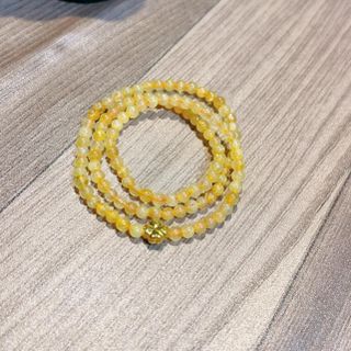 VÒNG TAY THẠCH ANH TÓC VÀNG THIÊN NHIÊN PHỐI CHARM CỎ BỐN LÁ VÀNG TÂY 10 KARA - THẮNG GIANG
