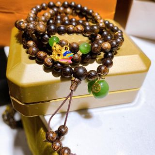 VÒNG TAY TRẦM HƯƠNG SÁNH CHÌM PHỐI TÚI TIỀN NGỌC BÍCH THIÊN NHIÊN BỌC VÀNG, HỒ LY VÀNG TA 24 KARA - THẮNG GIANG
