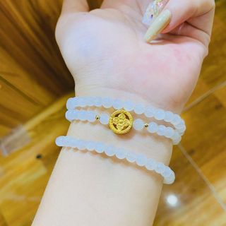 VÒNG TAY THẠCH ANH TRẮNG PHỐI CHARM BÁNH XE PHÁP LUÂN BẠC TA XI VÀNG 24 KARA - THẮNG GIANG