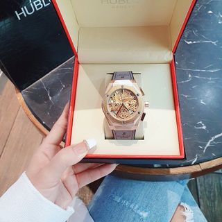 ĐỒNG HỒ NAM TRUNG CẤP HUB MẶT TRÒN GIẢ CƠ DÂY DA 2