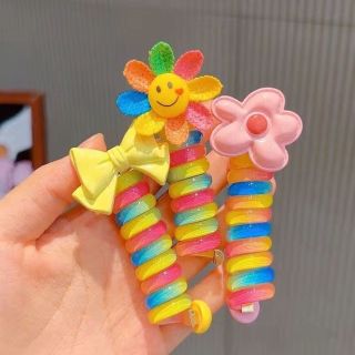 Chun cột tóc dạng lò xo xoắn tạo kiểu màu cầu vồng có đính hoa,Nơ dễ thương cho béDây buộc tóc lò xo cho bé ma16
