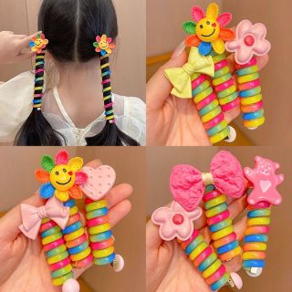 Chun cột tóc dạng lò xo xoắn tạo kiểu màu cầu vồng có đính hoa,Nơ dễ thương cho béDây buộc tóc lò xo cho bé ma16