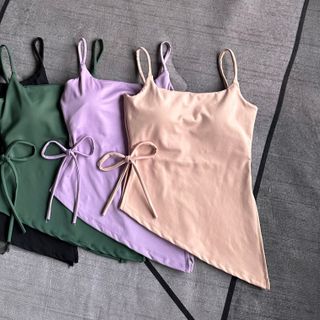 Hàng mới về Áo dây mảnh xẻ tà cột eo Thiết kế có bo chun ôm ngực tốt , có đường chỉ cố định mút ngực Chất thun poly 2da co giãn . Có khe nhét mút , vải dày dặn SML