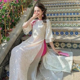Sỉ SLL Áo dài nữ hoa ép LỤC HẠ 4 tà, tay loe 2 lớp, cổ đính nơ màu be kèm nút bọc trẻ trung