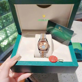 ĐỒNG HỒ NAM NỮ CAO CẤP RÔ LE DÂY THÉP MẶT MÀU KÍNH SAPHIRE VIỀN ĐÁ 1