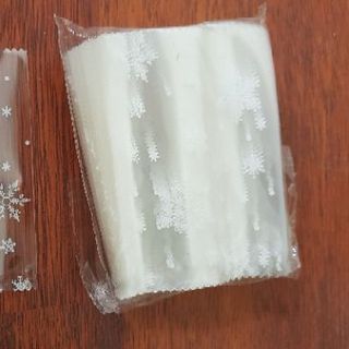Bịch 100 túi đựng bánh kẹo  hình bông tuyết size 7x10cm