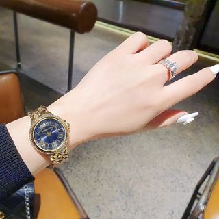 ĐỒNG HỒ NỮ THỜI TRANGHOT TREND M KORS MẶT TRÒN SỐ LA MÃ