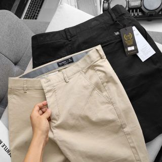 Short kaki nam. Chất thun co giãn. Dài vừa chấm trên gối