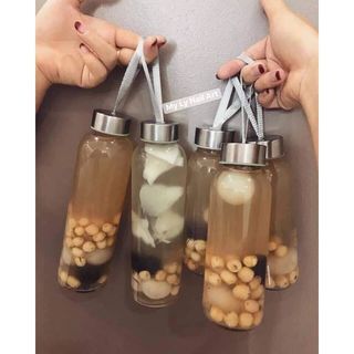 CHAI THỦY TINH TRÒN NẮP DÂY XÁCH 500ML