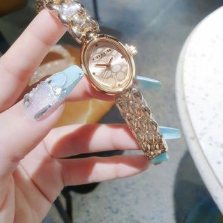 ĐỒNG HỒ NỮ THỜI TRANG KOACH LẮC MẶT OVAN HOA VĂN