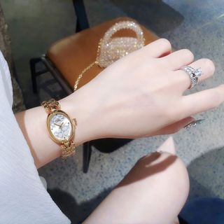 ĐỒNG HỒ NỮ THỜI TRANG KOACH LẮC MẶT OVAN HOA VĂN