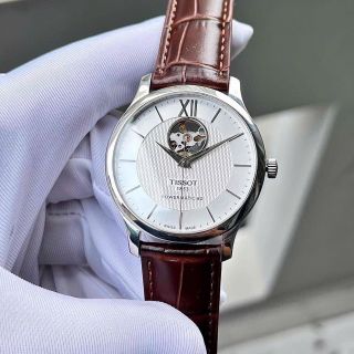ĐỒNG HỒ NAM CƠ SIÊU CẤP THỤY SĨ TISỚT DÂY DA KÍNH SAPHIRE LỘ MÁY MẶT TRẮNG VIỀN BẠC