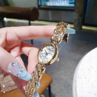 SALE BỎ MẪU ĐỒNG HỒ NỮ THỜI TRANG COAC LẮC MẶT OVAN HOA VĂN