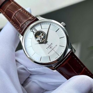 ĐỒNG HỒ NAM CƠ THỤY SĨ TISỚT DÂY DA KÍNH SAPHIRE LỘ MÁY MẶT TRẮNG VIỀN BẠC