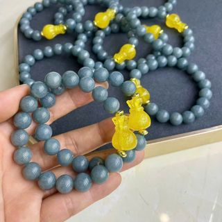 Vòng tay lam ngọc 10 li mix túi tiền hổ phách