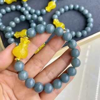Vòng tay lam ngọc 10 li mix túi tiền hổ phách