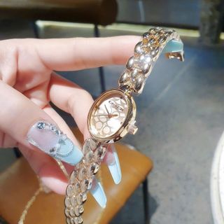 SALE BỎ MẪU ĐỒNG HỒ NỮ THỜI TRANG COATH LẮC MẶT OVAN HOA VĂN 5392