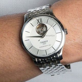 ĐỒNG HỒ NAM CƠ THUỴ SỸ TIXOT DÂY THÉP KÍNH SAPHIRE LỘ MÁY MÀU BẠC