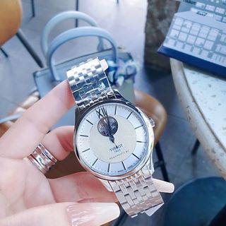 ĐỒNG HỒ NAM CƠ THUỴ SỸ TIXOT DÂY THÉP KÍNH SAPHIRE LỘ MÁY MÀU BẠC