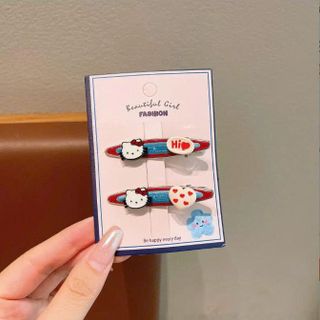 VĨ 2 KẸP TÓC KITTY NỀN XANH DƯƠNG