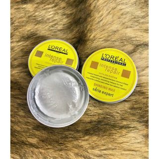 Sáp vuốt tóc L'OREAL trong tạo kiểu tóc tự nhiên.