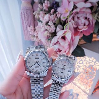 ĐỒNG HỒ NAM NỮ CAO CẤP RÔLET DÂY THÉP MẶT 3D NIỀNG KHÍA