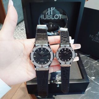ĐỒNG HỒ COUPLE SIÊU CẤP NHÀ MÁY HB HULOT CAO SU BỌC DA ĐEN CÓ GIẤY KIỂM ĐỊNH