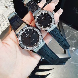 ĐỒNG HỒ COUPLE SIÊU CẤP NHÀ MÁY HB HULOT CAO SU BỌC DA ĐEN CÓ GIẤY KIỂM ĐỊNH