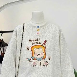 Áo dài tay nữ cổ tròn đính charm nút