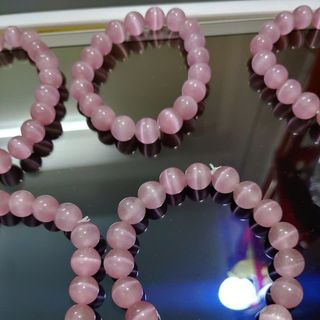 Chuỗi phong thủy đeo tay đá mắt mèo 10 li màu hồng