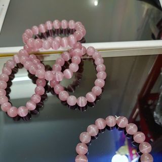 Chuỗi phong thủy đeo tay đá mắt mèo 10 li màu hồng
