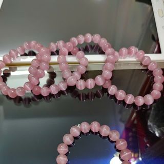 Chuỗi phong thủy đeo tay đá mắt mèo 10 li màu hồng