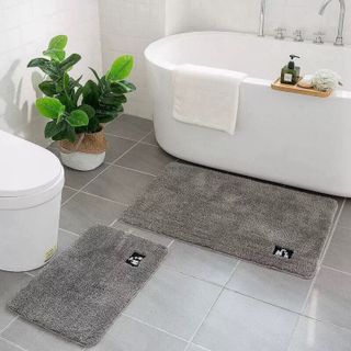 THẢM CHÙI CHÂN VẢI LEN ĐỂ NHÀ TẮM, THẢM PHÒNG KHÁCH CAO CẤP(LOGO THÚ, CHIẾC LÁ Ở GÓC THẢM)