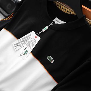 T-shirt LC phối màu.  Chất thun Cotton may phối lé, tay in chữ Logo nổi