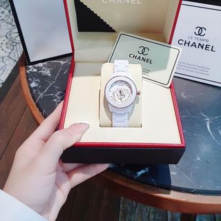 ĐỒNG HỒ NỮ CAO CẤP CHANEU CERAMIC ĐÁ TRẮNG MẶT HOA VIỀN HỒNG VÀ VIỀN BẠC