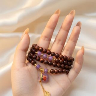 Trầm hương 108 hạt mix charm túi tiền tím