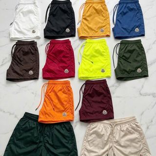Short  Moncler basic logo.  Chất dù trơn, may lót lưới phía trong.