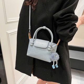 Túi xách nữ, túi đeo chéo da bò loang tặng kèm quả bông K579