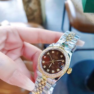 ĐỒNG HỒ NAM NỮ CAO CẤP ROLXE DÂY THÉP DEMI VÀNG MẶT NÂU KÍNH SAPHIRE VIỀN HỘT