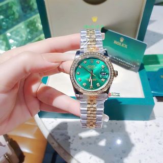 ĐỒNG HỒ NAM NỮ CAO CẤP ROLXE DÂY THÉP DEMI VÀNG MẶT XANH KÍNH SAPHIRE VIỀN HỘT