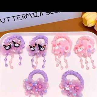 Sét cột tóc 2 dây tua rua cho bé gái