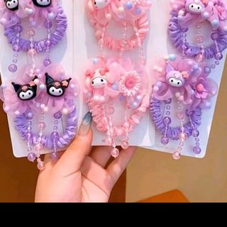 Sét cột tóc 2 dây tua rua cho bé gái