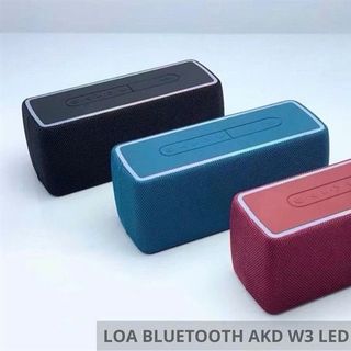Loa Bluetooth AKD-W3 màu đỏ, nổi bật với thiết kế bọc vải và dải đèn LED RGB đổi màu xung quanh viền.