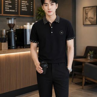 áo đen thêu H cổ bo dệt cao cấp