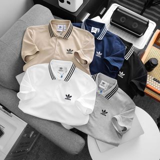 Mẫu áo cổ bẻ thể thao thiết kế bo sọc. Chất vải cá sấu cotton mềm mướt.
