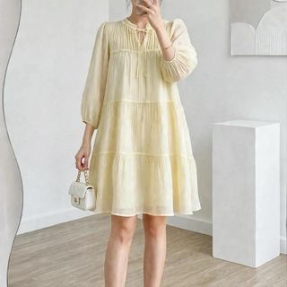 Đầm baby doll ngọt ngào dễ thương màu hồng pastel với thiết kế tay phồng và nơ cổ